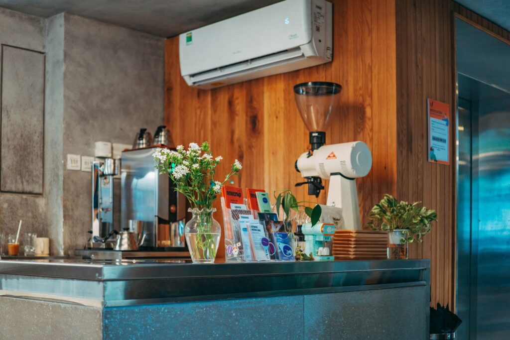 Well-serviced wall-mounted air conditioner keeping a commercial café space cool and comfortable.